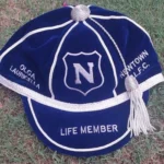Custom Honours Cap with embroidered front logo and text, designed for ceremonial or achievement recognition, made from high-quality fabric with a structured finish.