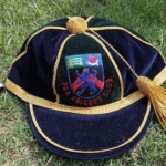 Custom Honours Cap with embroidered front logo and text, designed for ceremonial or achievement recognition, made from high-quality fabric with a structured finish.